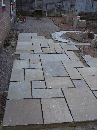 The patio stones go down